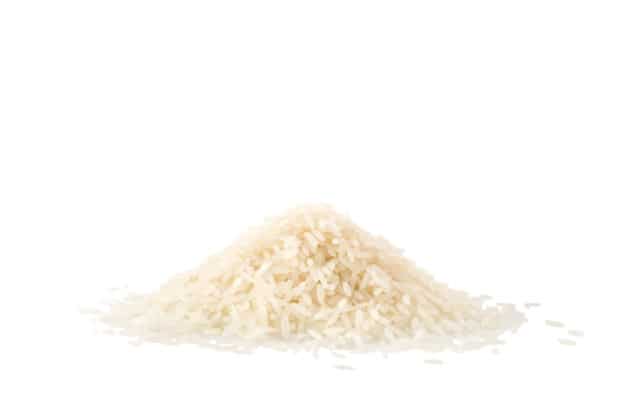 Pile of jasmine rice on white
